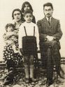 Left to right Qamar Taj Qavami Manouchehr Ghavami held by Qamar Taj Ghavami's arms Mehrafzun Ghavami back row Hossein Gholi Ghavami standing and Ahmad Mo Ayed ol Molk Ghavami seated 1927 or 1928