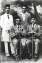 Qavam-ol-Molk Shirazi, standing on the left